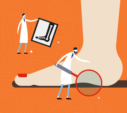 Doctor examining flat feet to understand the causes of the foot condition